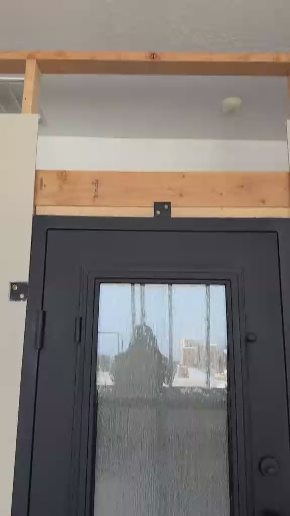 Load video: Biltmore 43 Black Exterior Double Wrought Iron Door with Eyebrow Top